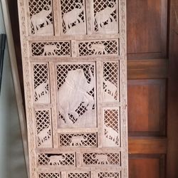 Hand carved wood elephant panel.