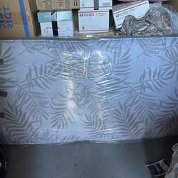 2 full bed mattresses and grey bed frames