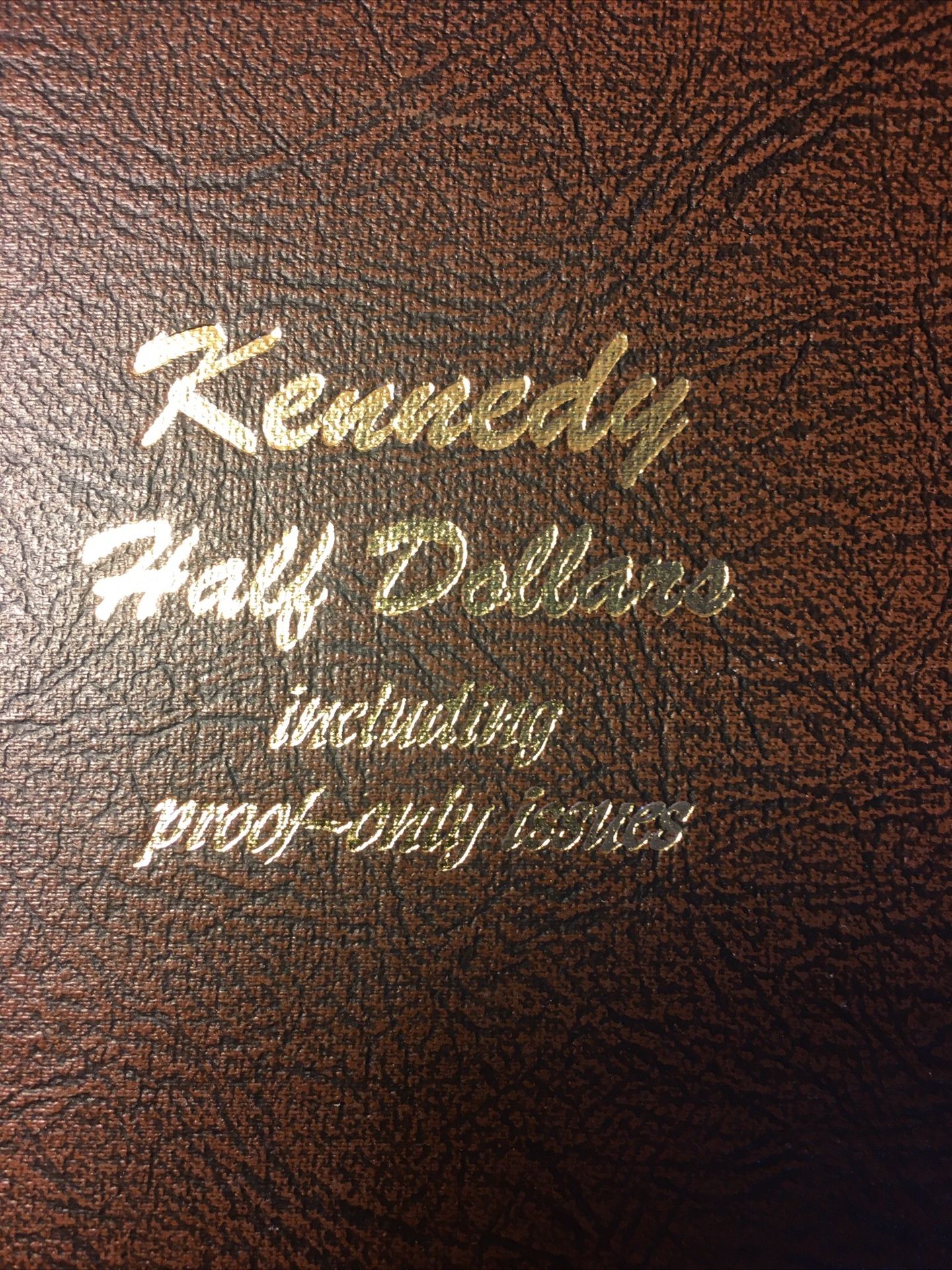 106 KENNEDY HALF DOLLARS IN A DANSCO ALBUM