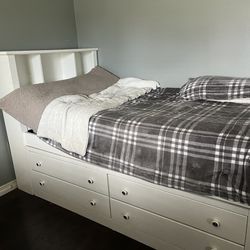 Twin sized white bed 