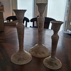 set of three white-washed candlestick holders