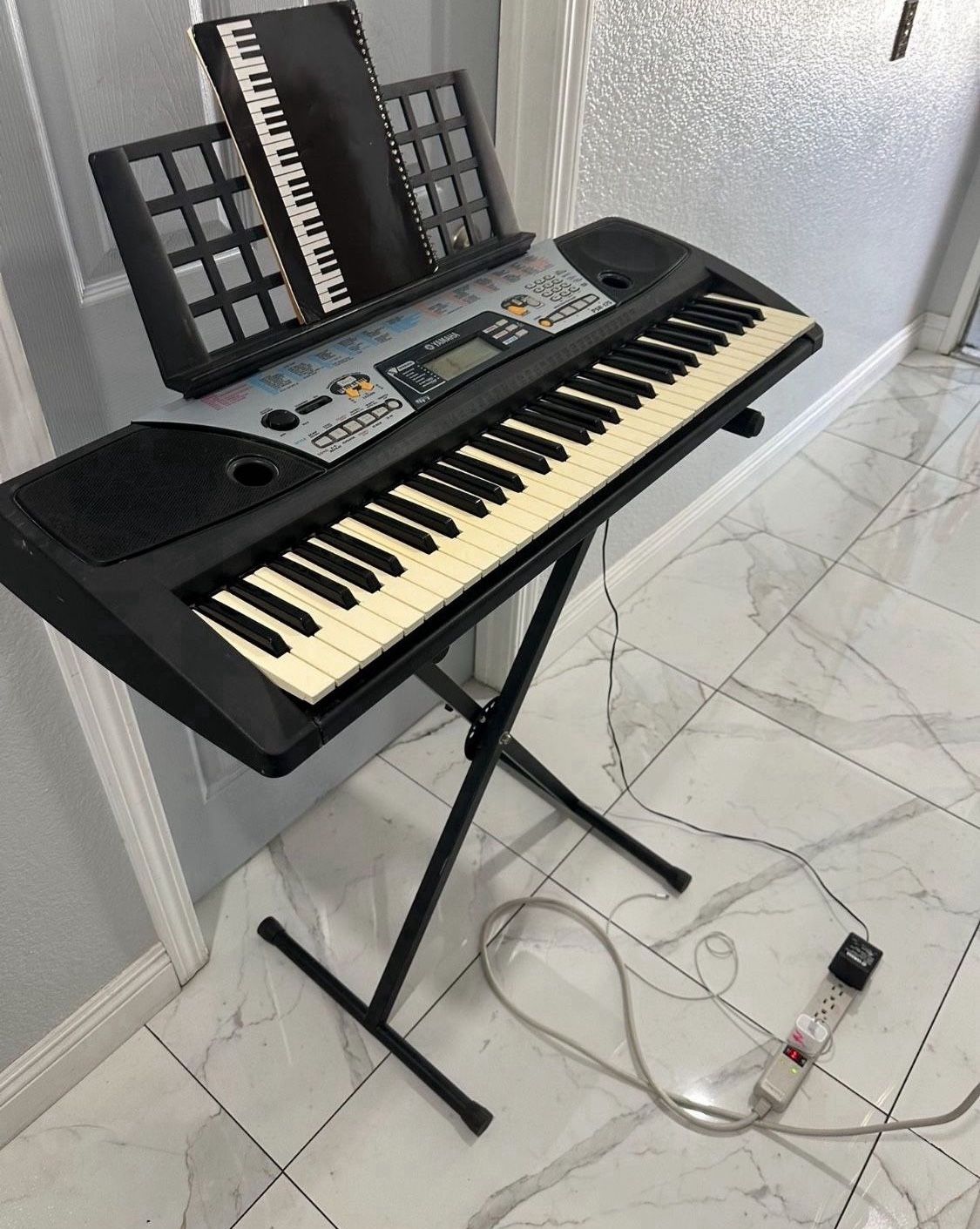 Great Yamaha Keyboard With Stand.  ,comes With Wall Charger ! Works Great 