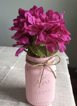 Distressed mason jar with silk flowers