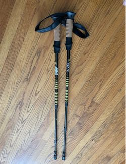 Carbon fiber hiking poles, lightweight but with some quality issues. Originally, they had two sections that could be extended in length. One of them i