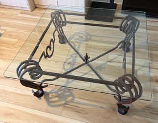 Modern Glass Coffee Table with Decorative Metal Base