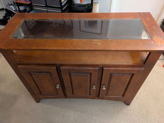 Wooden credenza with glass top