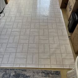 a piece of linoleum 9x7