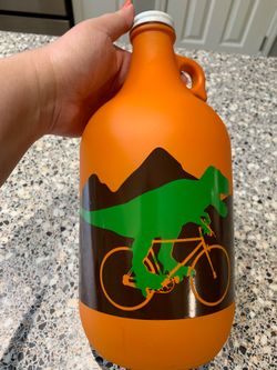 Biking dinosaur coin bank