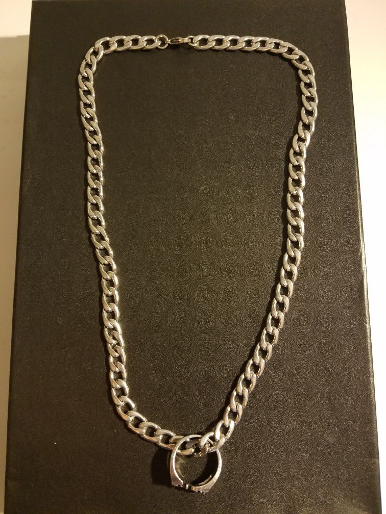 Stainless steel cuban chain with f off ring pendant.