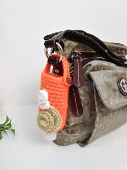 Amigurumi hand sanitizer holder. crochet hand sanitizer pouch. body lotion holder. bag charm. backpack hand sanitizer holder. gel disinfectant