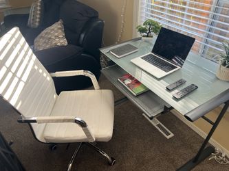 modern glass desk and leather office chair