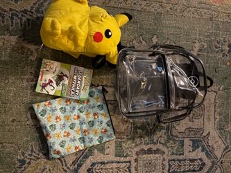 Pokemon bookbag and stuffie as well as a Pokemon book