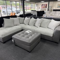 New 2 Tone Sectional $999. Oversize Ottoman $369. Delivery Available 