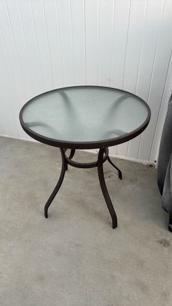 Outdoor glass top patio table