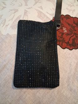 New cute 9x5 black bling wristlet. supper cute mpu serious buyer don't deliver cash only price firm no delivery