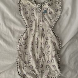 $10 Love to Dream Swaddle Up Original in a rainbow print allows babies to sleep with their arms in a natural upward position
