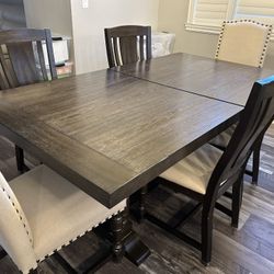 Beautiful wood dining room table with leaf, 8 chairs and 4 bar stools (can buy separately)