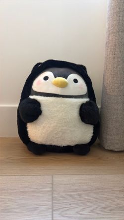 Black cat with penguin inside.