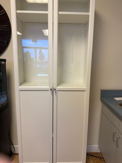 2 white cabinets