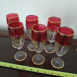 vintage ruby red and gold-decorated wine glasses