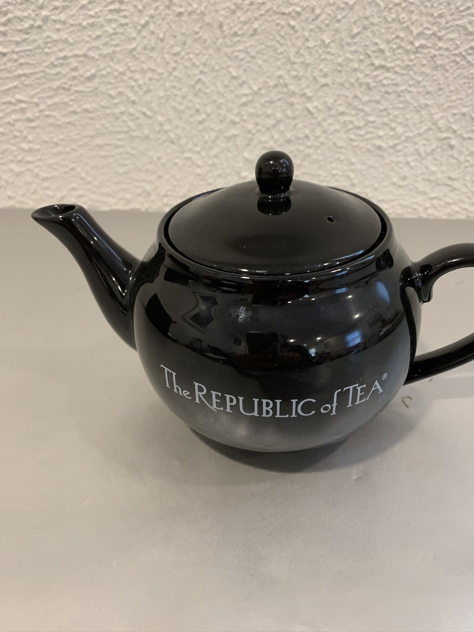 Black Ceramic Republic Of Tea New , Never Used 8” From Spout To Handle And 4” Tall , Made In Thailand   If you see it here , it is available 