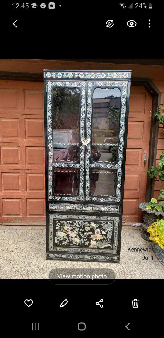 Korean black lacquer mother of pearl curio cabinet. Cost $1500