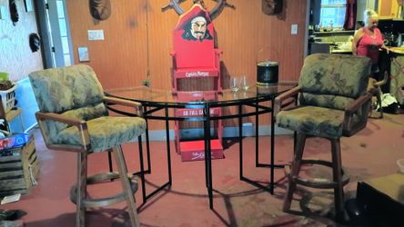Two matching solid oak Douglas swivel bar chairs, curved glass top bar table, vintage ice bucket and two glasses. Great condition, everything works sm