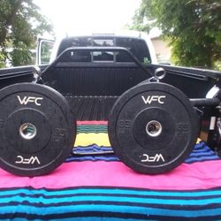 OLYMPIC 55 LB. HEX BAR & TWO 35 LB. HI  TEMP   BUMPER PLATES 