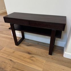 Wood console table with swivel drawers