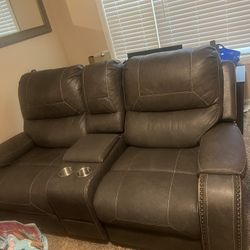 Two Grey Leather Love Seats 