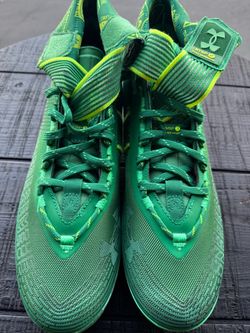 Green Under Armor Cleats size 12