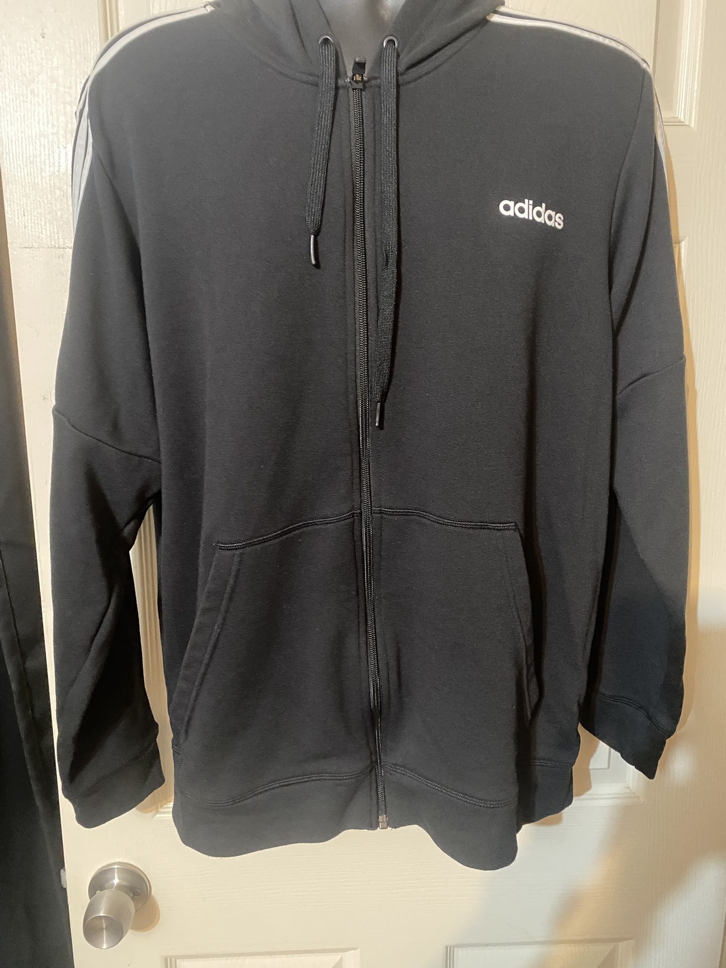 Adidas Essentials 3-Stripes Full-Zip Fleece Hoodie in black.