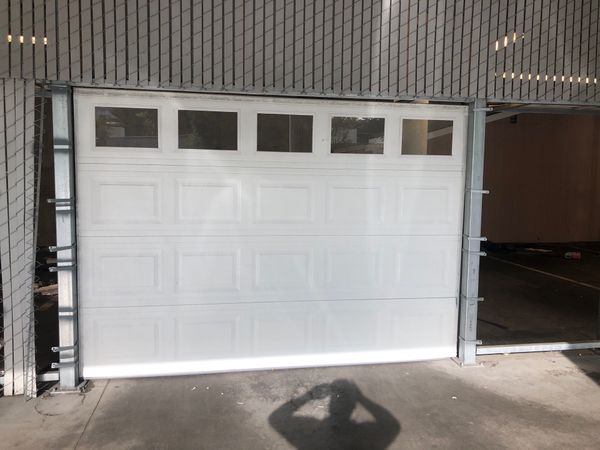 Garage door 10 foot wide 8 foot tall for Sale in Tacoma 