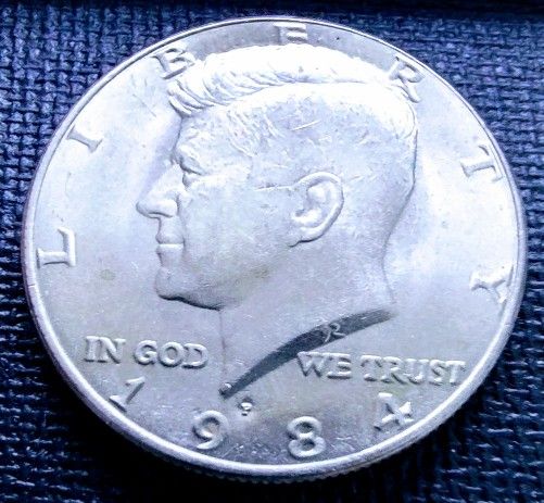 1984-P Kennedy Half Dollar In Very Good Circulated Condition.