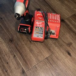 Electric dril and a battery charger