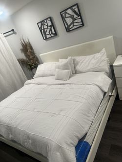 king size bed plus drawer plus paintings
