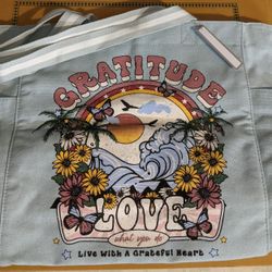 Tote, NEW with tags, 20 1/2 wide, x 14 3/4 depth, zip top, compartment on back zips, 1 inside. Exxon 2428 E Lamar Alex Pkwy, Maryville