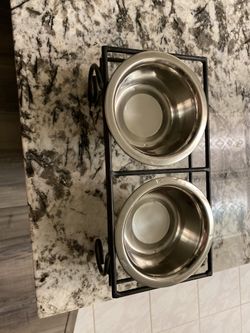 Pet bowls on wrought iron stand