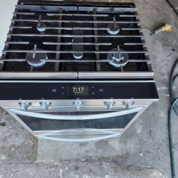 30-inch wide stove is a 5-burner gas stove, Whirlpool brand.