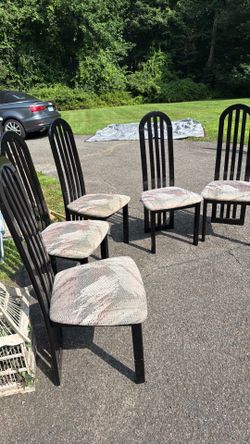 Five black lacquer chairs with upholstered seats