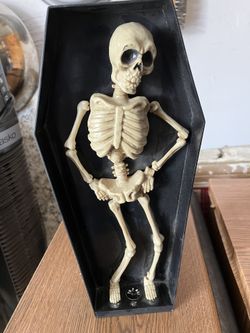 Skeleton in coffin Halloween decoration