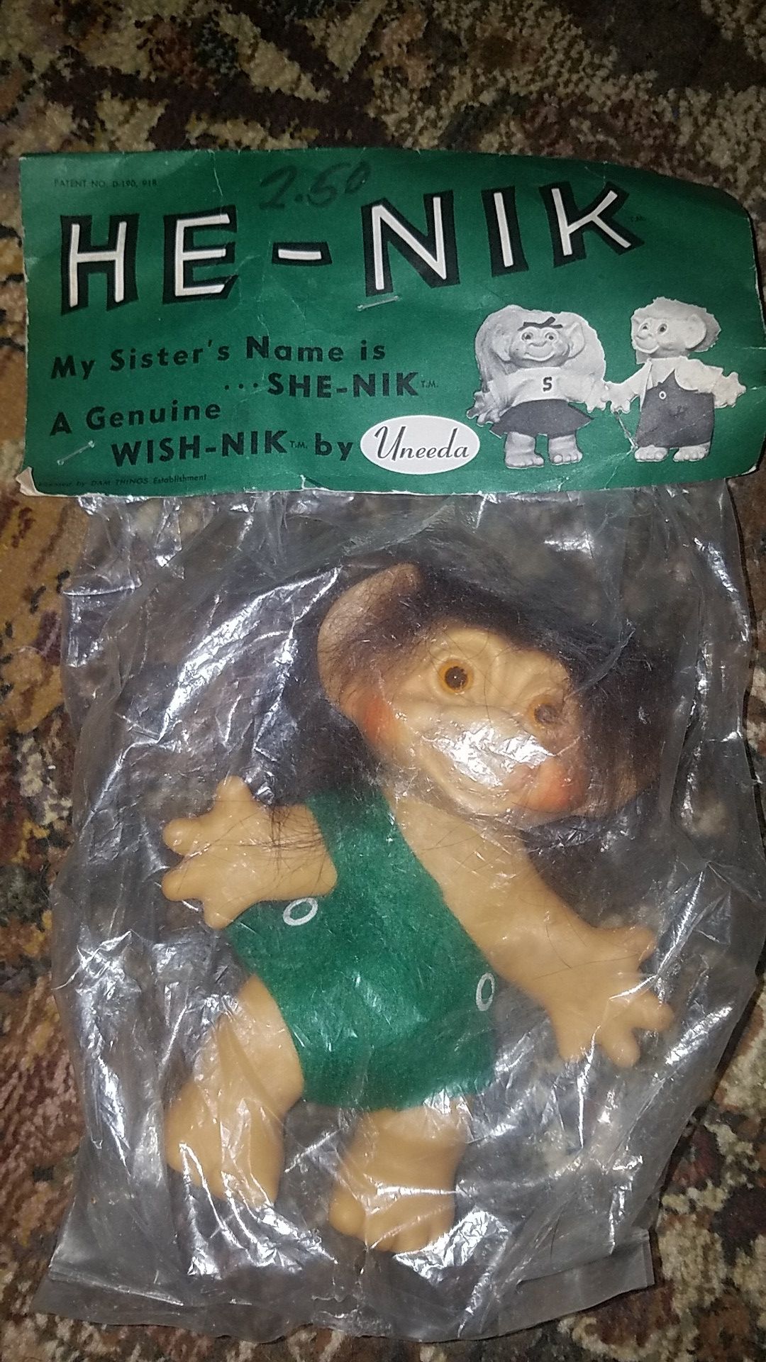 1960's He-Nik Troll Doll by Undeea. As new condition in original packaging. 6" tall. There are a couple of small holes in the plastic