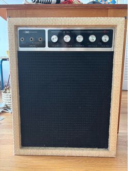 vintage bass amp in rattan woven type material cute for a music master