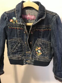 Girls lot of jackets and a pair of boots .