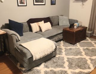 Grey sectional couch with ottoman
