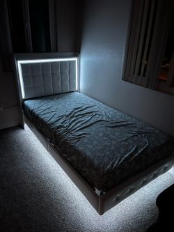 bed with led lights and charging station