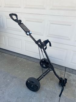 Pushing golf cart