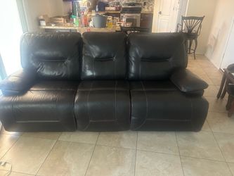 Italian leather couch. And recliner. Electric controls