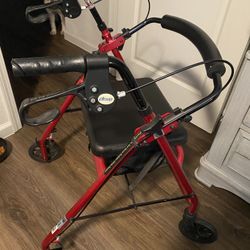 Drive walker with a seat, also known as a rollator. 