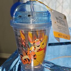 Disney Winnie the Pooh plastic tumbler includes a dome lid, straw, and fruit punch flavored candy sticks.
